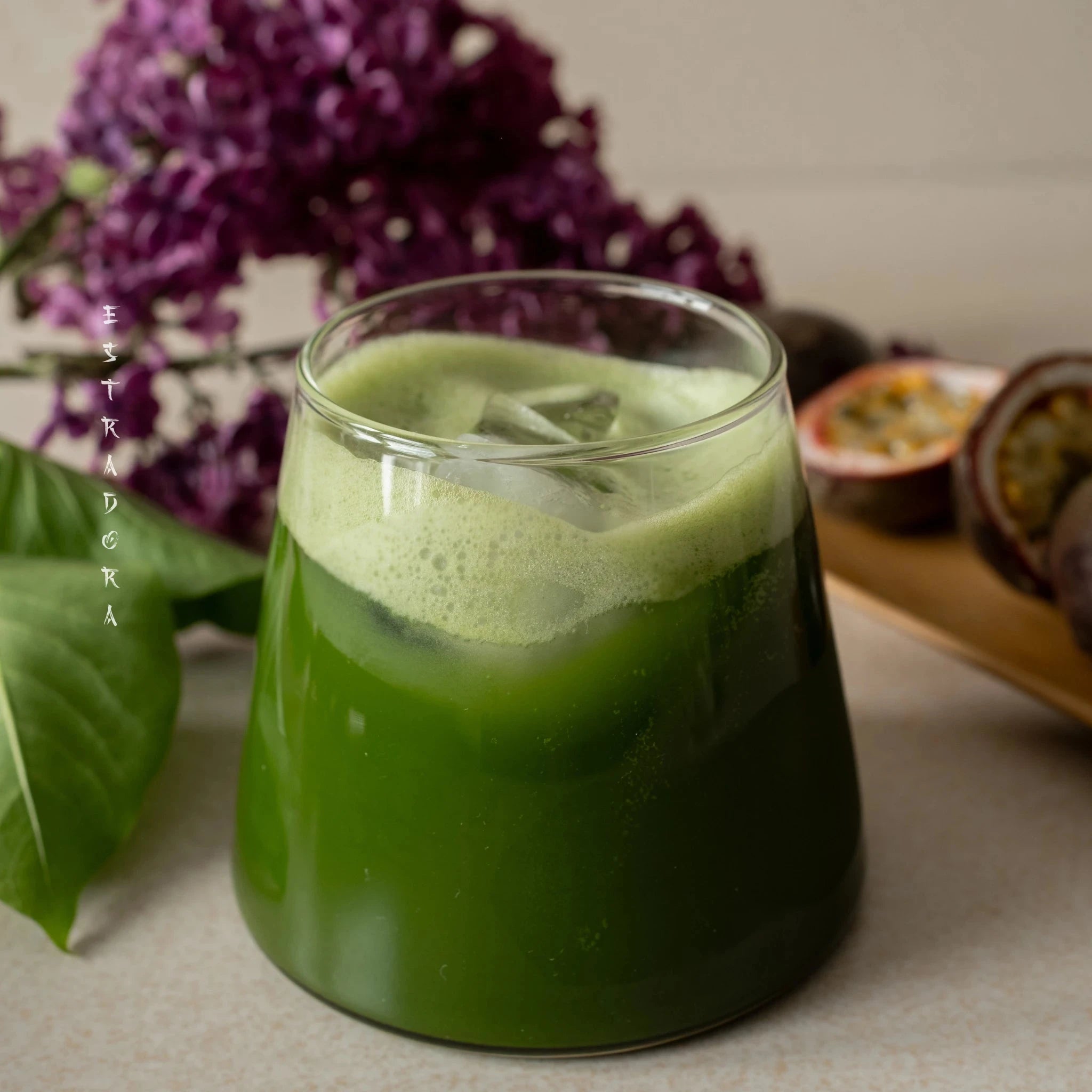 MATCHA NAMI | Iced Japanese matcha latte in glass – vibrant green ceremonial matcha drink with foam, served with passion fruit