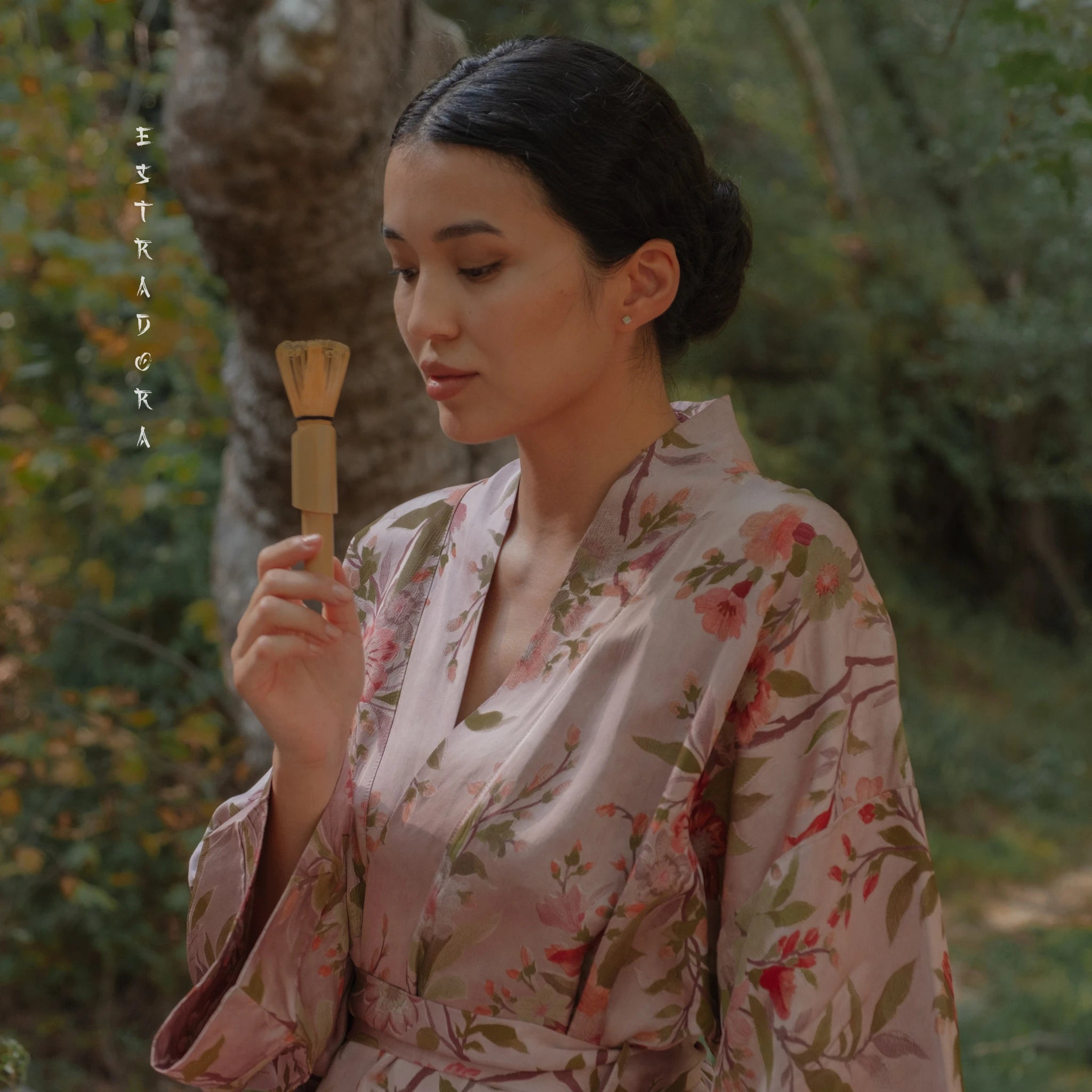 Japanese woman in kimono holding bamboo chasen – tea ceremony moment ESTRADORA