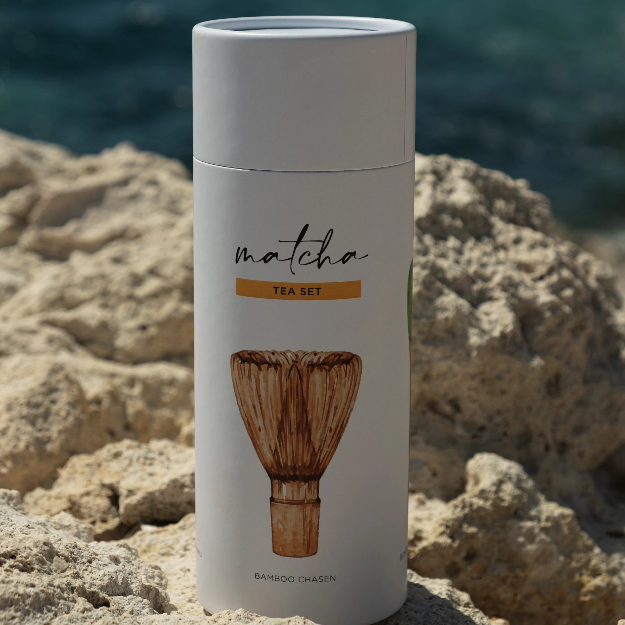 BAMBOO WHISK SET FOR MATCHA BREWING – bamboo whisk tube on natural stone background ESTRADORA